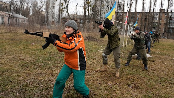 Civilians train with members of the Georgian Legion, a paramilitary unit formed mainly by ethnic Georgian volunteers to fight against Russian forces in Ukraine in 2014, in Kyiv, Ukraine.