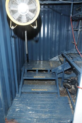 Inside the trapdoor, police walked down a set of sturdy stairs and into the three shipping containers where the cannabis was allegedly grown. 