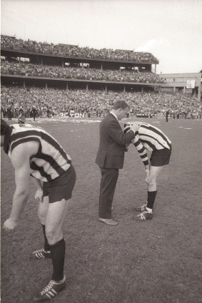 Collingwood coach Bob Rose consoles Ross ‘Twiggy’ Dunne after the devastating loss.