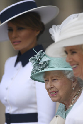 US First Lady Melania Trump, left, attends a welcome ceremony with the Queen and Camilla, Duchess of Cornwall, right, in the garden of Buckingham Palace.