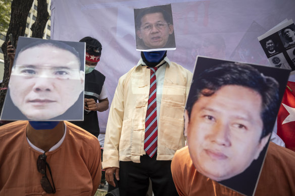 Activists stage a play condemning the coup leader Min Aung Hlaing at an anti-Myanmar junta demonstration in front of the United Nations building in Bangkok on February 1.