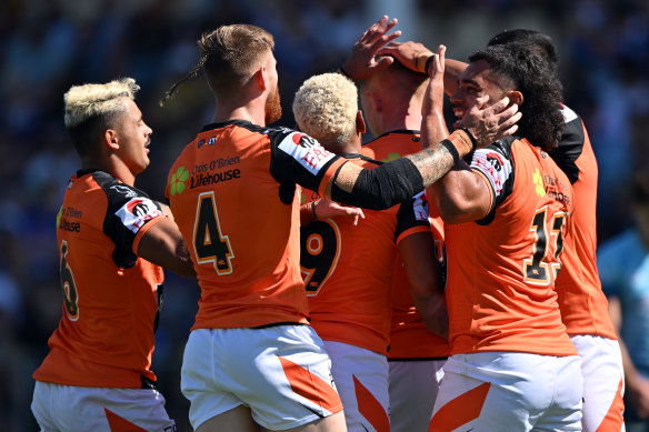 The Tigers celebrate a try. 