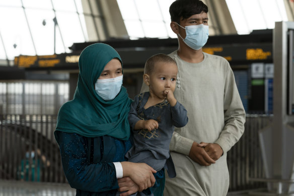 Families evacuated from Kabul, Afghanistan, after they arrived at Washington Dulles International Airport, in Chantilly, Virginia.