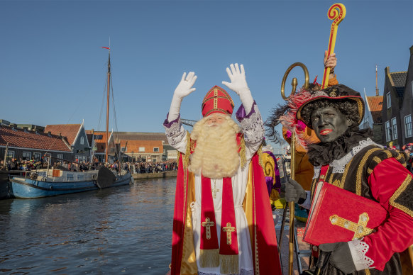 The arrival of Sinterklaas and his helpers Black Pete in Monnickendam, Netherlands.