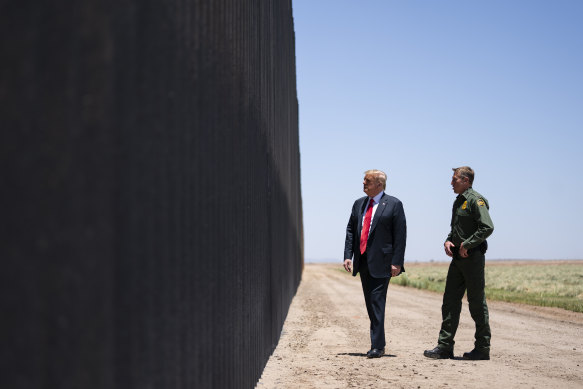 United State Border Patrol chief Rodney Scott gives President Donald Trump a tour of a section of the border wall in San Luis, Ariz, earlier this week.