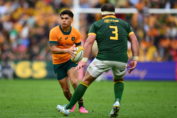 Noah Lolesio taking the ball to the line against the Springboks in Brisbane.