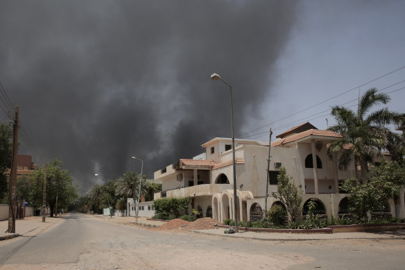 Smoke is seen rising from a neighbourhood in Khartoum. 