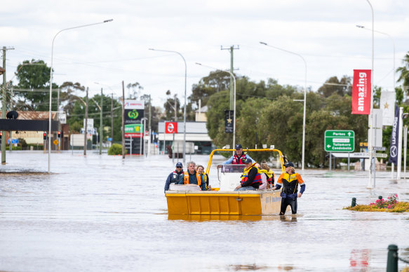 NSW Maritime crews ferry people on Lachlan Street in Forbes on Wednesday.