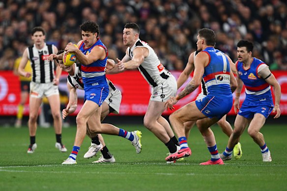 Joel Freijah gathers the ball while under pressure on Friday night.