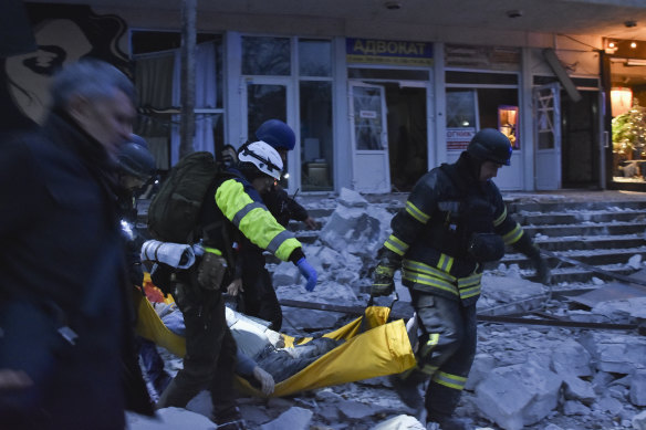 Rescuers help wounded civilians in December after a Russian missile strike in Zaporizhzhia, Ukraine.