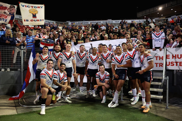 The Roosters team in front of the banner celebrating Jennings’ 300th game.