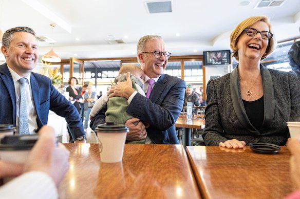 Opposition Leader Anthony Albanese holds Labor frontbencher Mark Butler’s baby Charlie as he meets with former prime minister Julia Gillard.