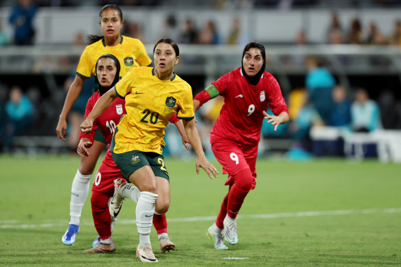 Mary Fowler and  Samantha Kerr prepare for a corner kick during the Matildas’ Olympic qualifier match against Iran.