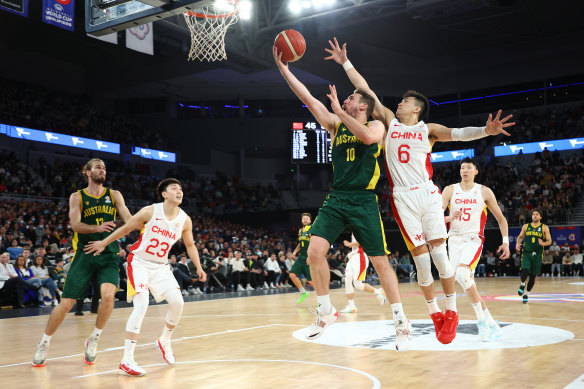 Australia’s Mitch McCarron drives to the basket against China in 2022.