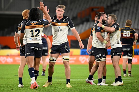 Brumbies celebrate their win over the Highlanders.