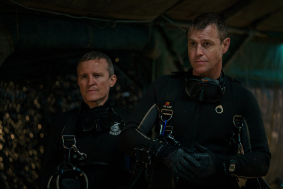 Damon Herriman (left), who plays Australian diver Craig Challen, with  Corser on set. The actors practised cave diving in a pool by swimming under trestle tables. 