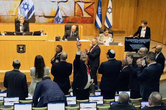 Israeli Minister of National Security, Itamar Ben-Gvir (centre), and members of parliament celebrate after passing the law approving the death penalty for Palestinians convicted of murdering Israelis.