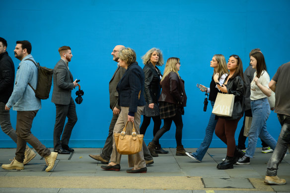 Pedestrians and shoppers are pictured in London’s Oxford Street retail district, as COVID cases grow.