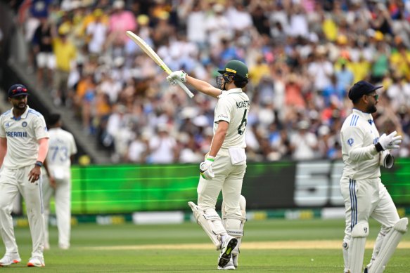 Sam Konstas raises his bat after an extraordinary 50 on debut at the MCG in the Boxing Day Test.