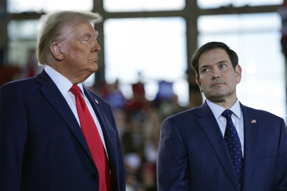The great dealmaker: Trump and Secretary of State Marco Rubio late last year.