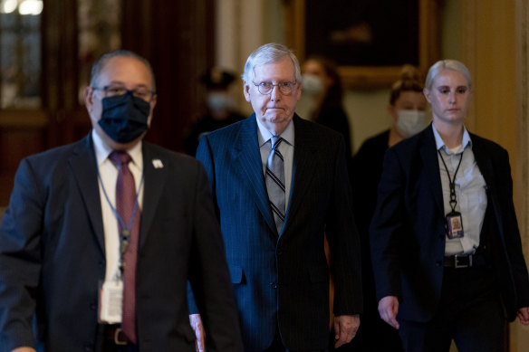 Senate Republican leader Mitch McConnell, centre, has stayed behind the scenes for much of the bipartisan work.