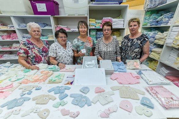 Treasured Babies volunteers (left to right): Anita Hartley, Yvonne Wallace, Jean Kroese, Cindy Furby and Liz Martin holding some of the items they make.