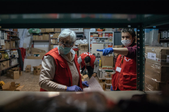 Red Cross volunteers at a food bank in Huesca, Spain have been helping people affected by the coronavirus.