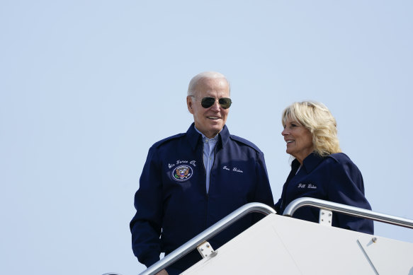 President Joe Biden and first lady Jill Biden stand at the top of steps of Air Force One before boarding at Andrews Air Force Base on Saturday, as they head to London.