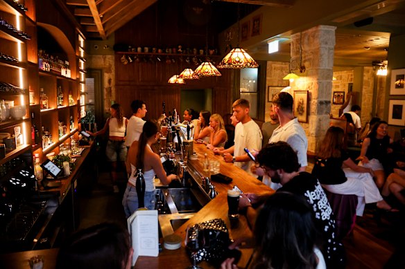 Cushy booths, sandstone walls and stained glass lightshades give the space a beautifully nostalgic feel.