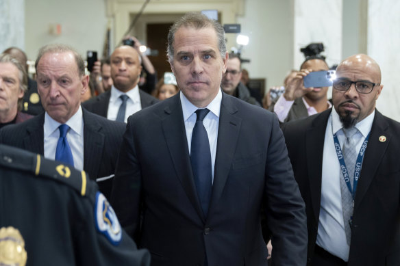 Hunter Biden, President Joe Biden's son, accompanied by his attorney Abby Lowell, left, leaves a House Oversight Committee hearing as Republicans take the first step toward holding him in contempt of Congress.