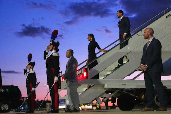 Vice President J.D. Vance, right, and second lady Usha Vance disembark from Air Force Two on arrival at Leonardo da Vinci International Airport in Rome.