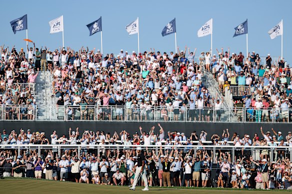 Aaron Rai and the crowd respond as his putt on the 17th falls in.