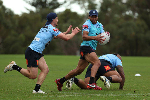 Damien Cook and Apisai Koroisau in concert during Origin training.