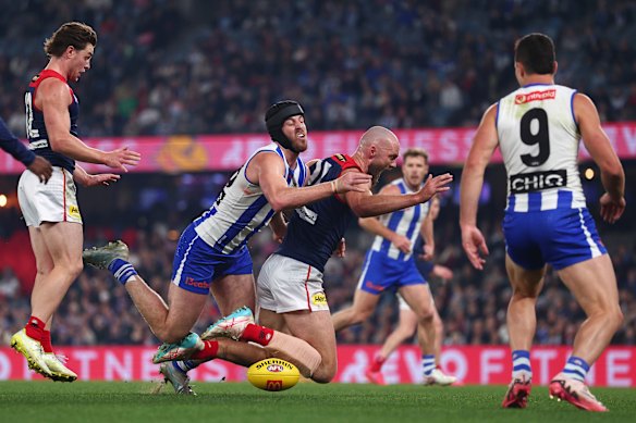 Max Gawn of the Devils and Tristan Xerri of the Kangaroos competing for the ruck.
