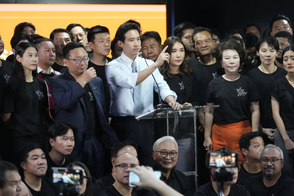 Former leader of Move Forward Party Pita Limjaroenrat talks to reporter with lawmakers from Move Forward Party during press conference at the party’s headquarters in Bangkok.