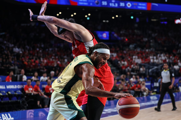 Patty Mills drives against Germany.