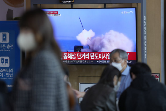 A TV screen shows a news program reporting on North Korea’s missile launch with file footage at Seoul Railway Station in Seoul, South Korea, on Saturday.