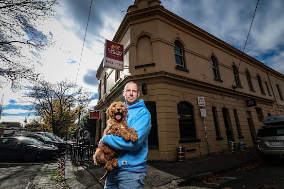 Neil Spark with his dog Bailey outside the Rose Hotel in Fitzroy. 