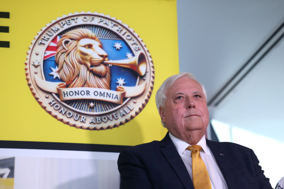 Palmer stands before the insignia for his new party.
