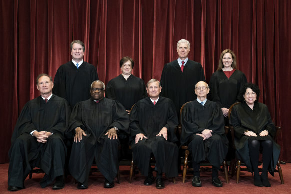 The Justices of the US Supreme Court, including Justice Clarence Thomas, seated second from left.