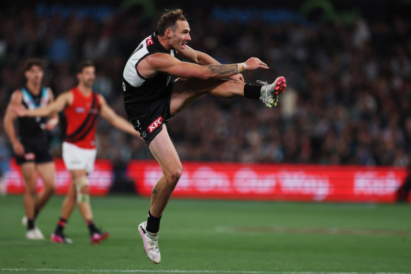 Port Adelaide’s Jeremy Finlayson boots the ball forward on Friday night.