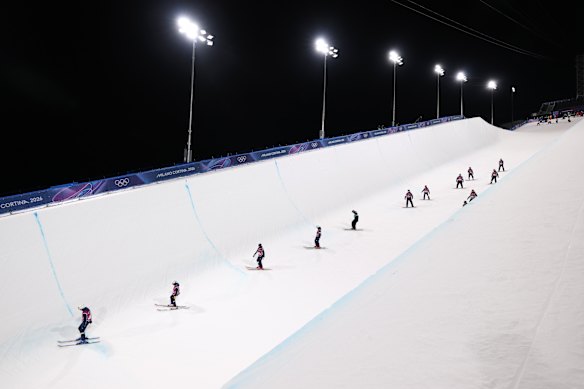 Riders in Livigno inspect the Olympic halfpipe course.