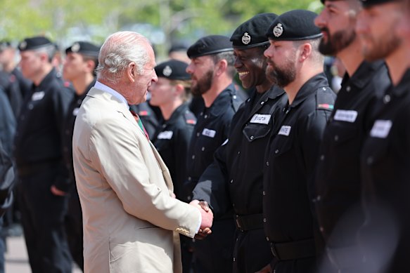 King Charles III meets RTR soldiers on parade during Royal Tank Regiment Families Day in Dorset.