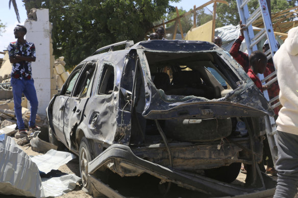 A view of a car destroyed during an attack at the Asasey Hotel in Kismayo, Somalia.