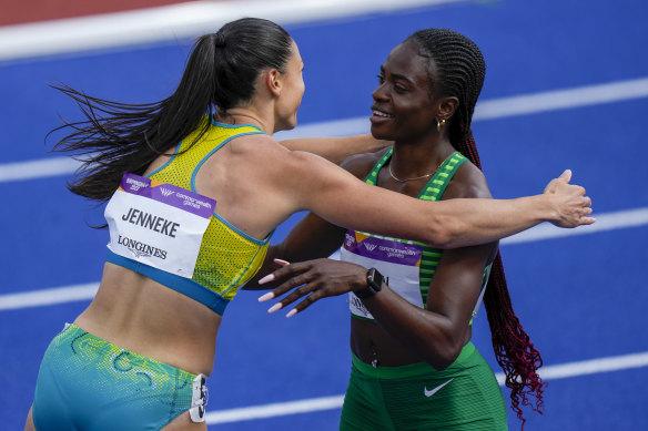 Tobi Amusan and Michelle Jenneke share an embrace after both qualifying for the final.