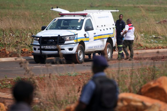 Forensic investigators work at the site where the body of a woman was discovered last week.
