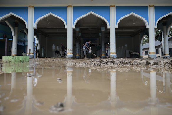 The cleanup begins at a mosque in a Pidie Jaya village.
