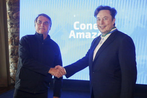 Elon Musk, here with Brazil’s then-president Jair Bolsonaro, was the first foreign civilian to receive the country’s Defence Order of Merit medal.