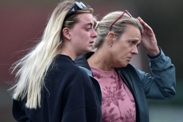 Two women console one another at the scene of the Applegreen service station explosion in Creeslough, Ireland.