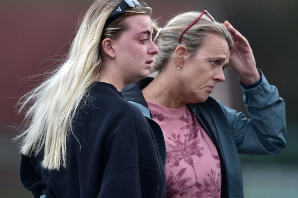 Two women console one another at the scene of the Applegreen service station explosion in Creeslough, Ireland.